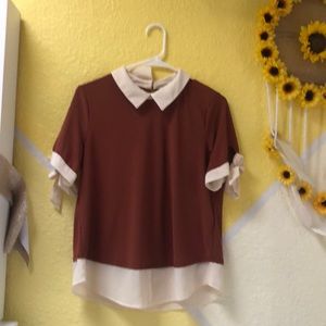 White and brown blouse
